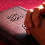 praying_on_bible_red.small